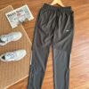 NIKE 梭織速乾運動長褲49