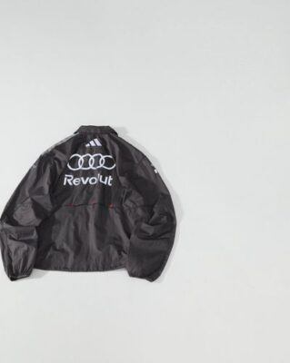 Adidas 機能外套評價：激光透氣孔細節展示，微褶尼龍材質挺括質感