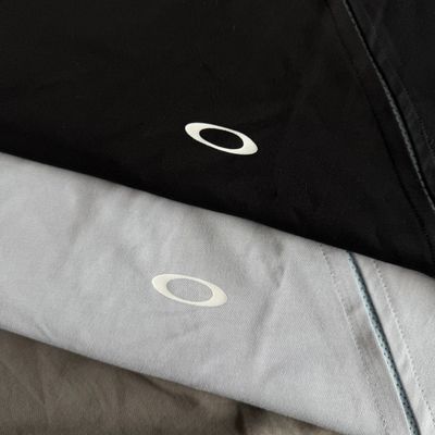 OAKLEY 歐克利解構機能短袖 T 恤 不規則剪裁透氣網眼拼接男女中性上衣